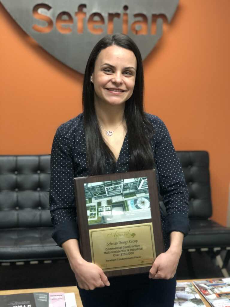 Carolina holding LO award plaque for Paradigm Phase 1