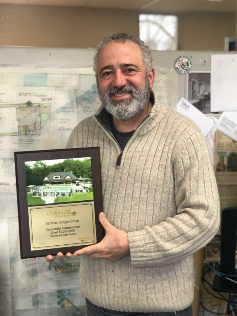 Haig Seferian holding LO award plaque